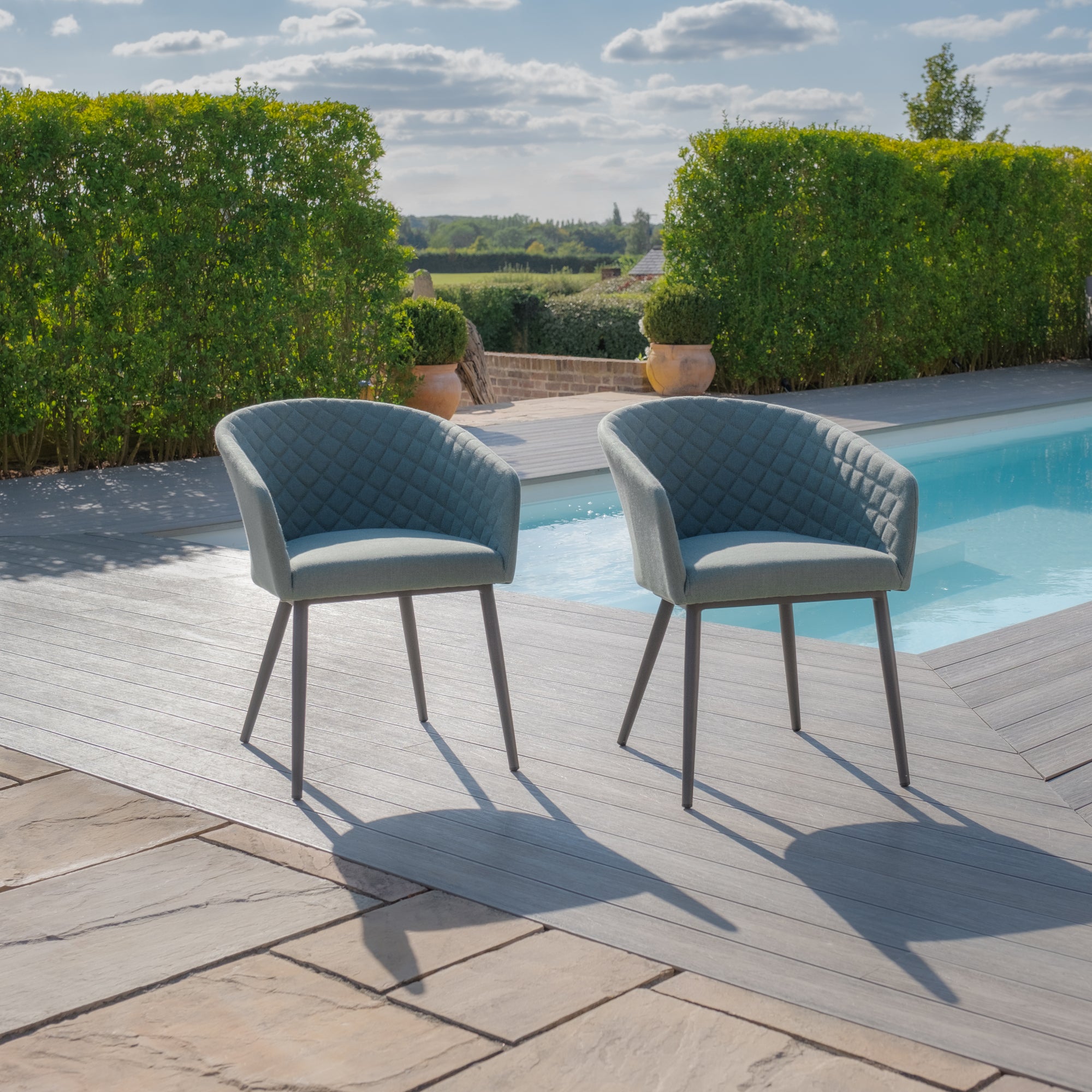 Maze - Jakarta Teak Extending 6 - 10 Seat Rectangular Dining Table with 10 Outdoor Fabric Ambition Sage Green or Oatmeal Dining Chairs